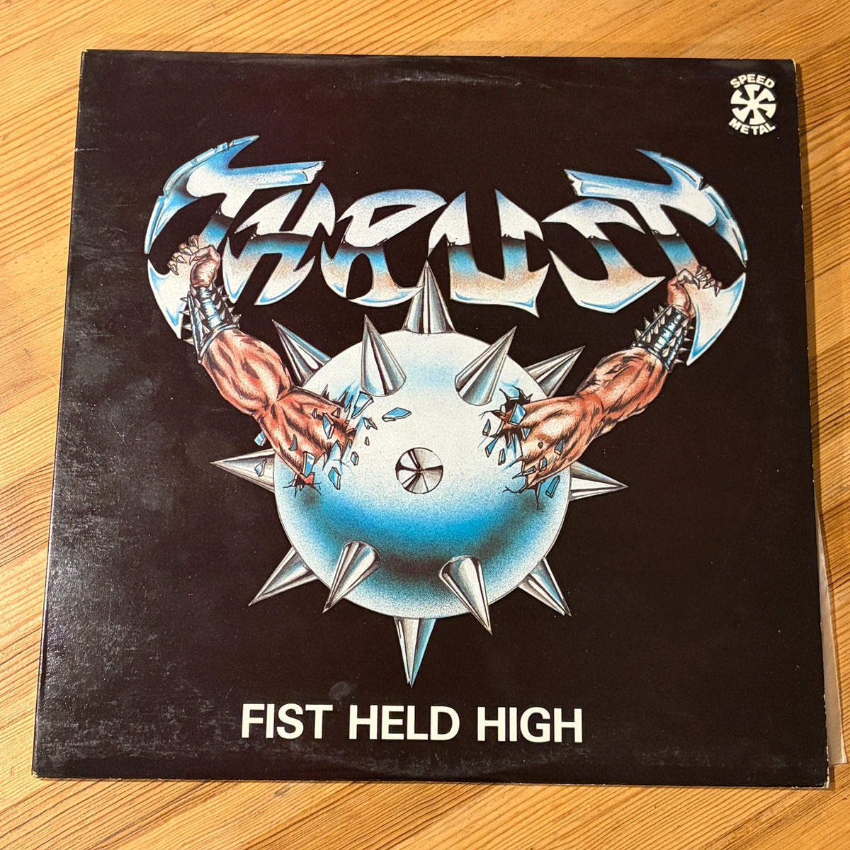 THRUST - FIST HELD HIGH