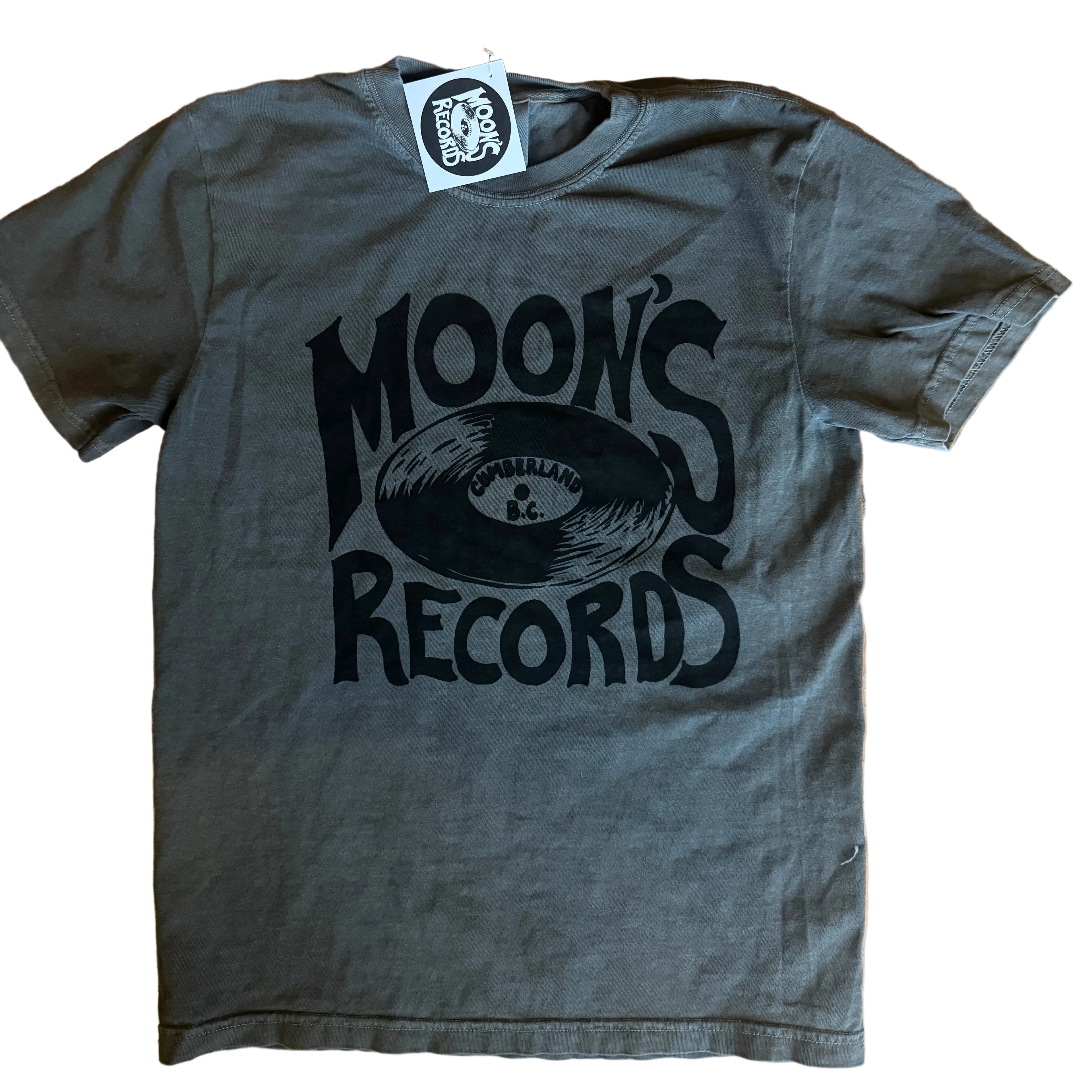 Gray t-shirt with 'Moon's Records' logo on a wooden surface