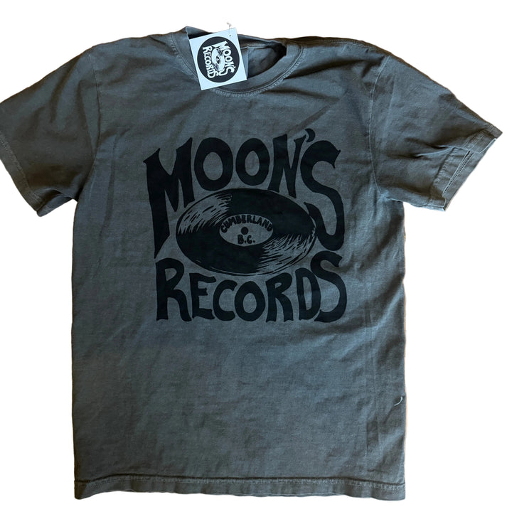 Gray t-shirt with 'Moon's Records' logo on a wooden surface