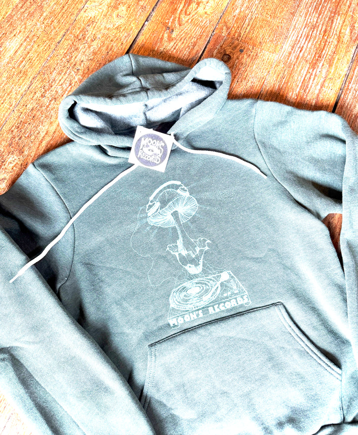 Gray hoodie with a graphic design on a wooden floor