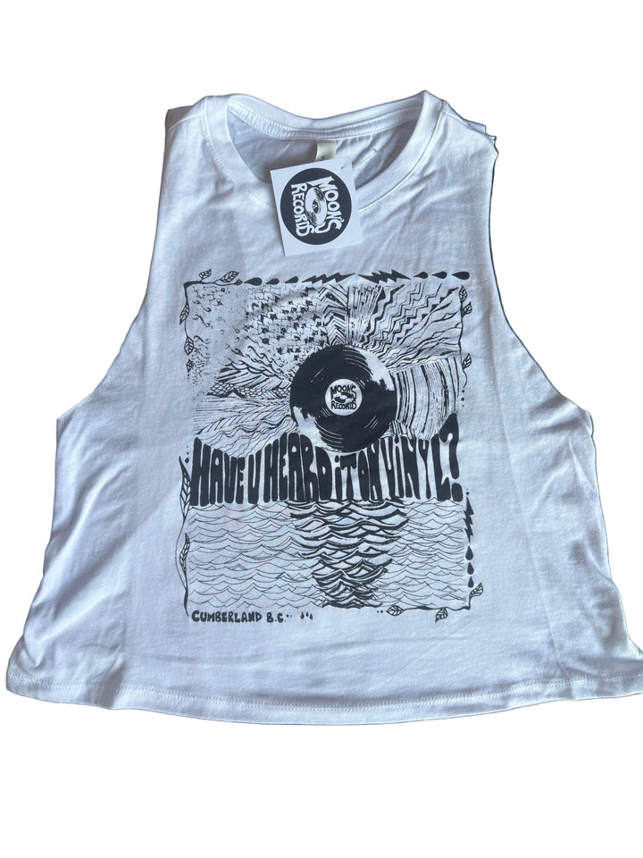 White t-shirt with black graphic design on a dark surface