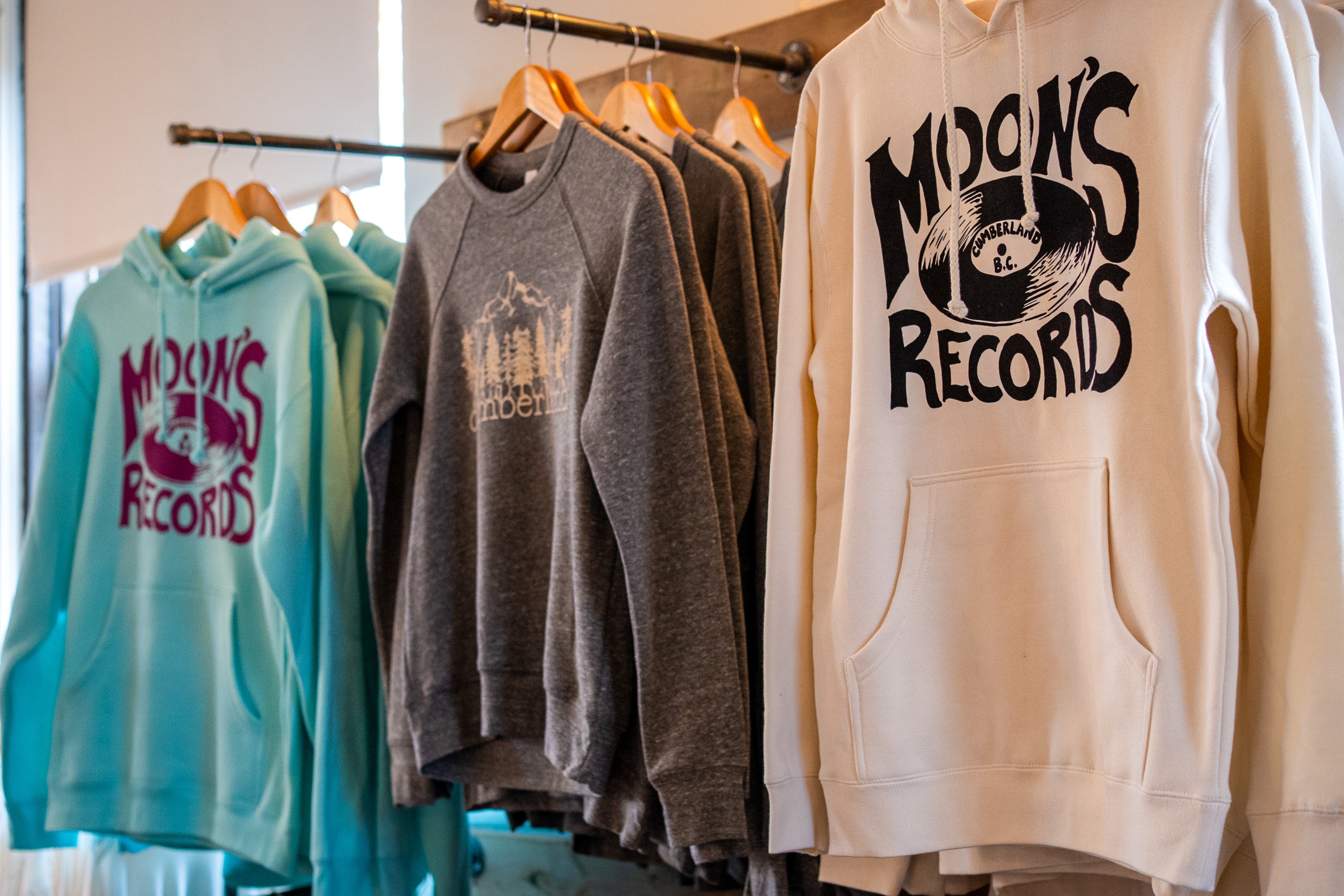 hanging rack of moons records sweatshirts front