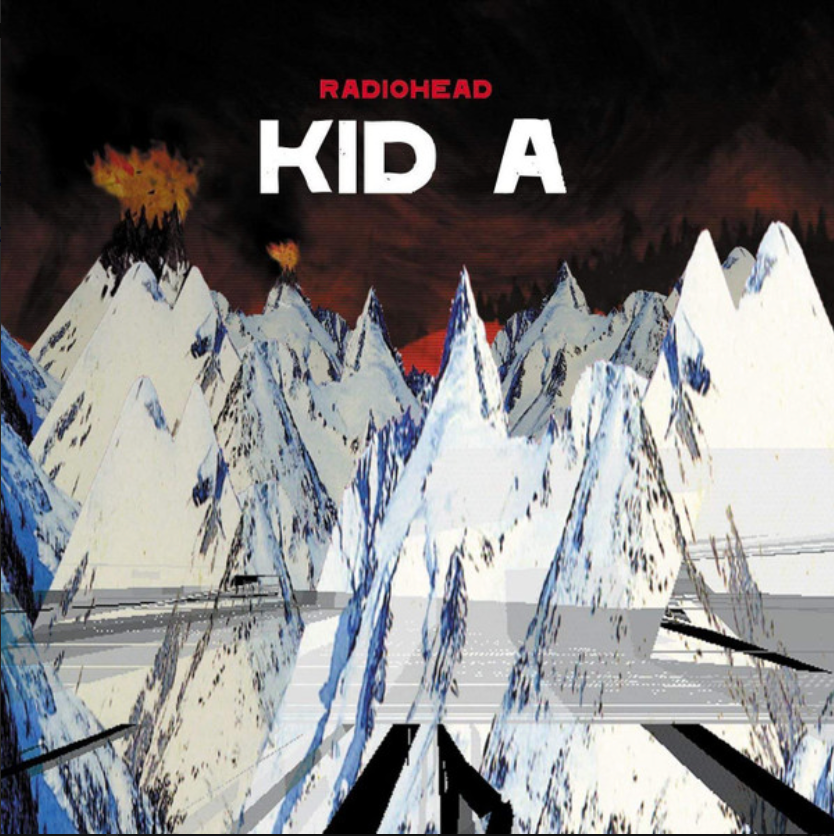 Album cover for RADIOHEAD's 'Kid A' featuring a stylized, mountainous landscape with a red sky.